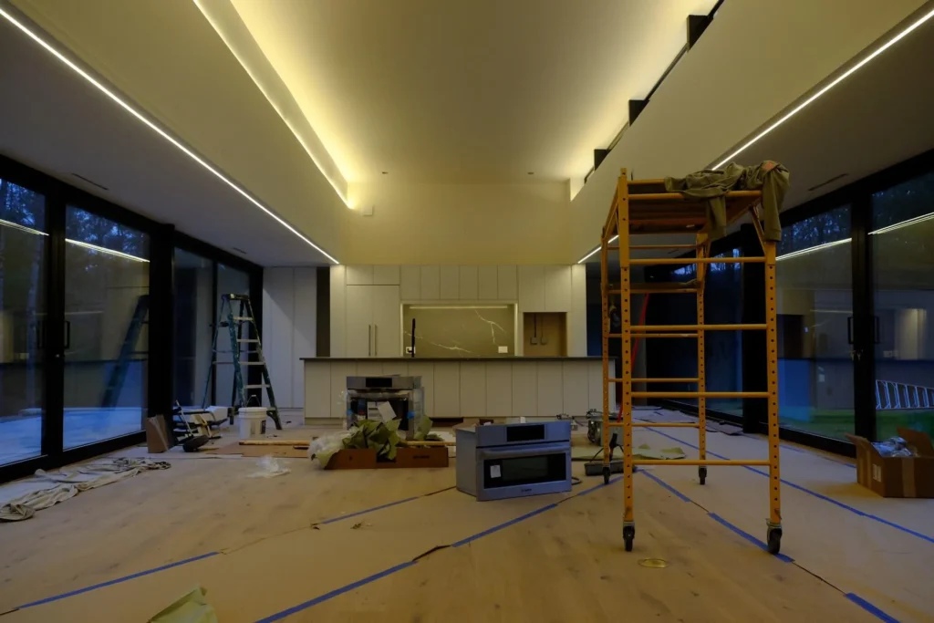 Modern kitchen under renovation with cabinetry installation in progress