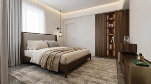 Bright bedroom with dark wood bed and wardrobes at Globe Residency Karachi