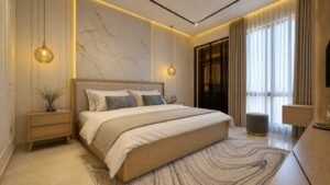 Master bedroom with light wood bed and marble feature wall at Globe Residency Karachi