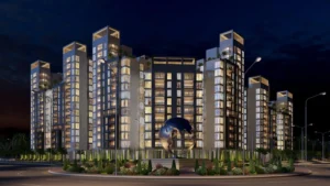 Illuminated night view of Globe Residency residential towers in Naya Nazimabad Karachi