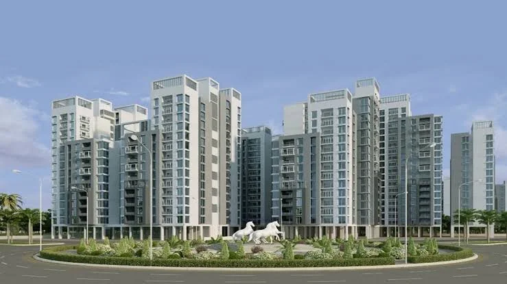Illuminated residential towers with globe monument at night in Globe Residency project