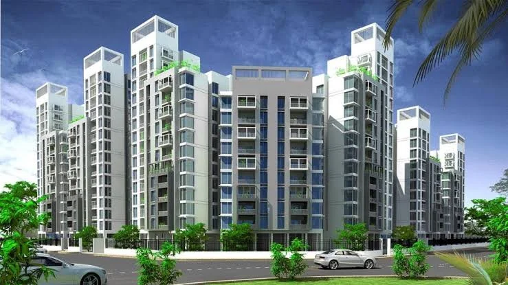 Elegant white residential towers with green landscaping at Peace Apartments project